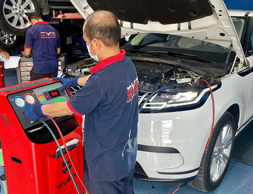 How Car AC Servicing Helps You Save Fuel in Dubai Mechanic Repairing Land Rover Car AC