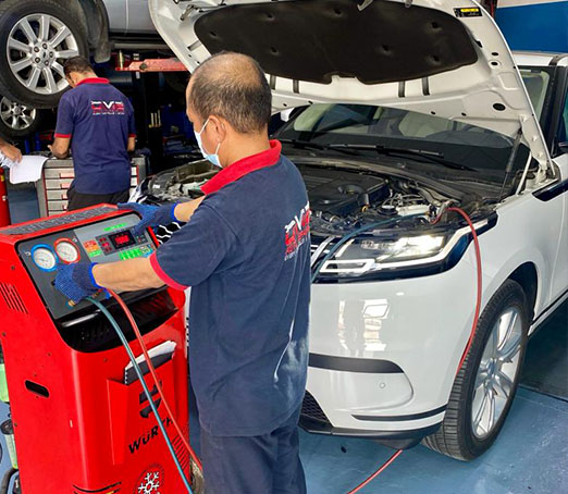 Mechanic Repairing Land Rover Car AC